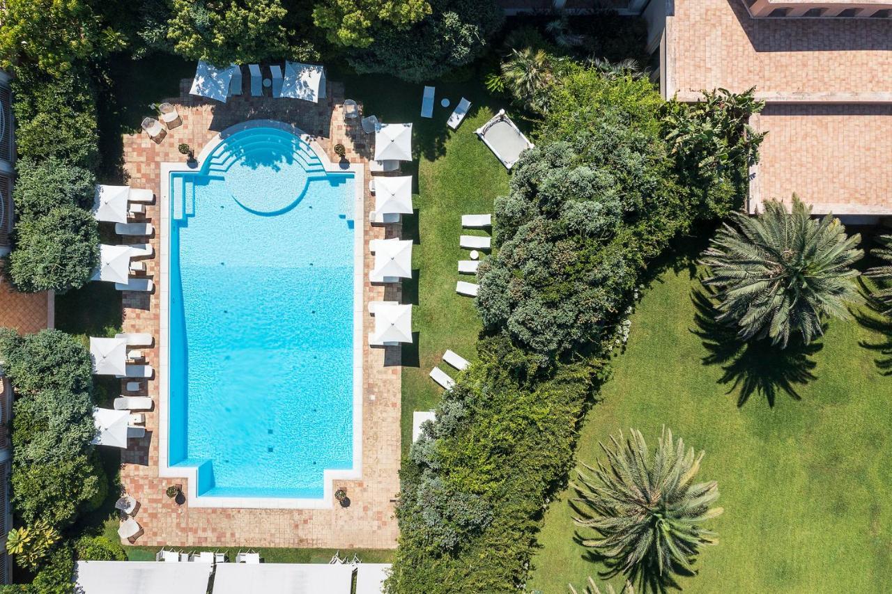 Romano Palace Luxury Hotel Catania Esterno foto Aerial view of the pool