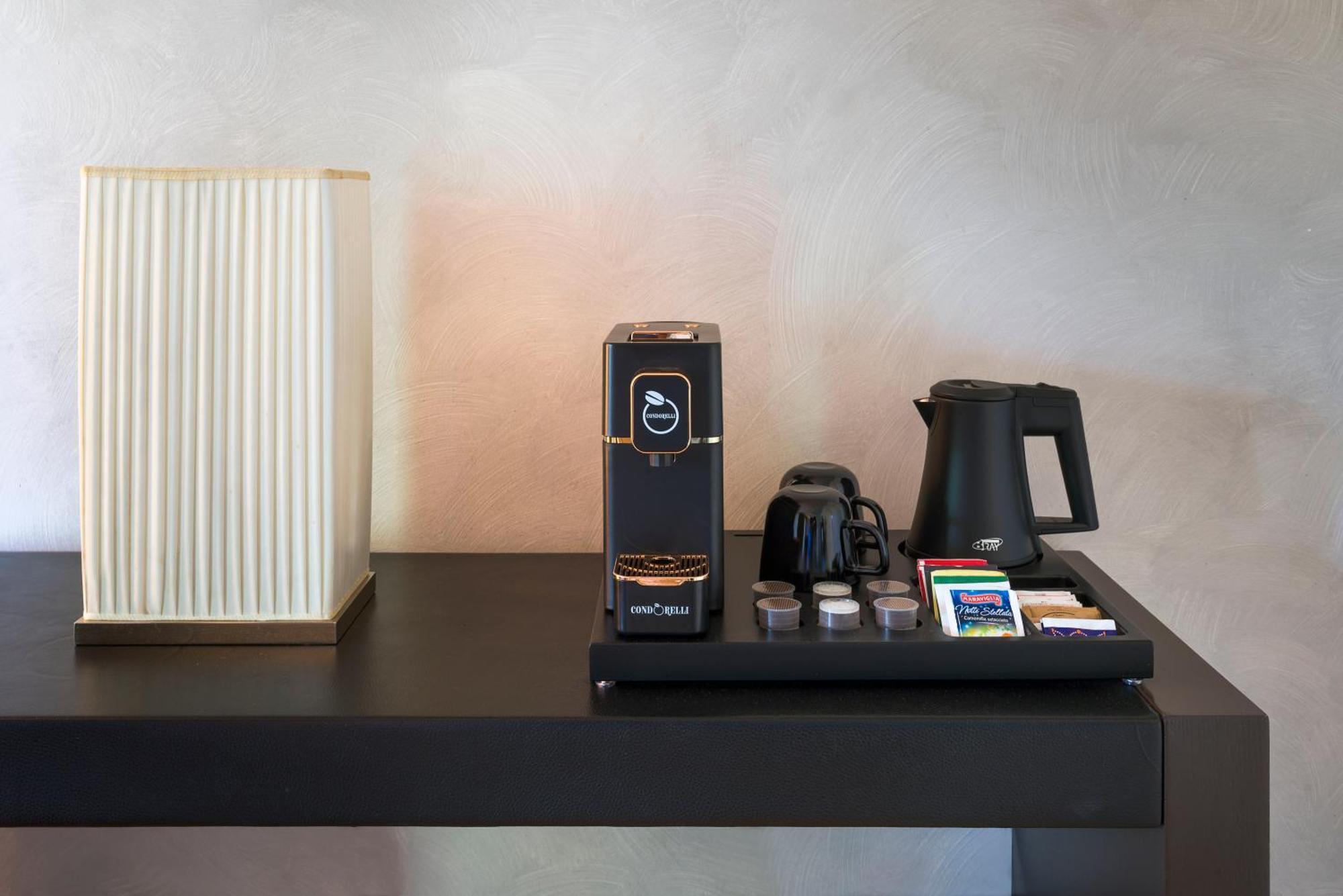 Romano Palace Luxury Hotel Catania Esterno foto A Nespresso coffee machine in a hotel room
